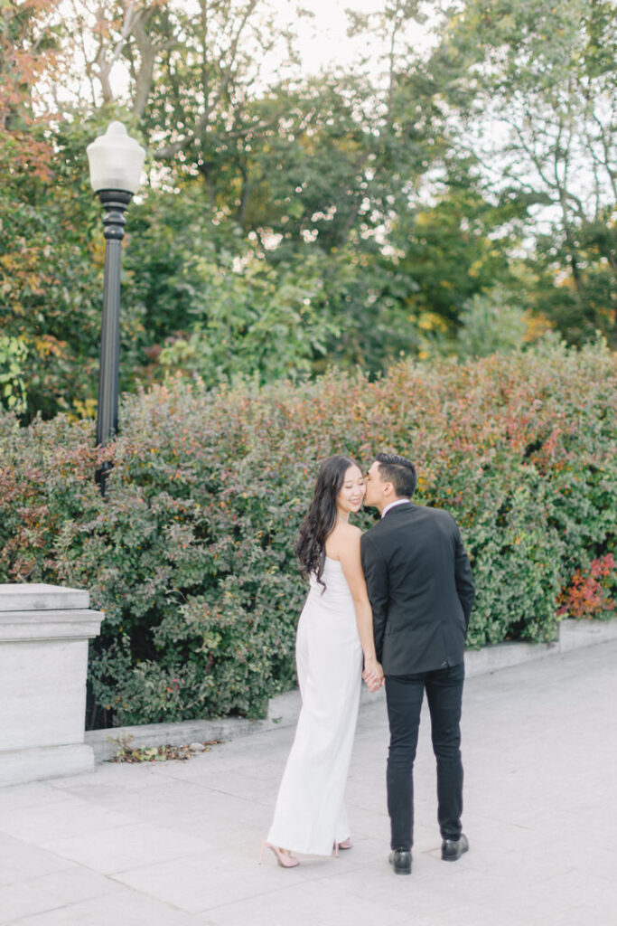 Authentic capture of a couple lovingly strolling at Mount Royal during their engagement shoot