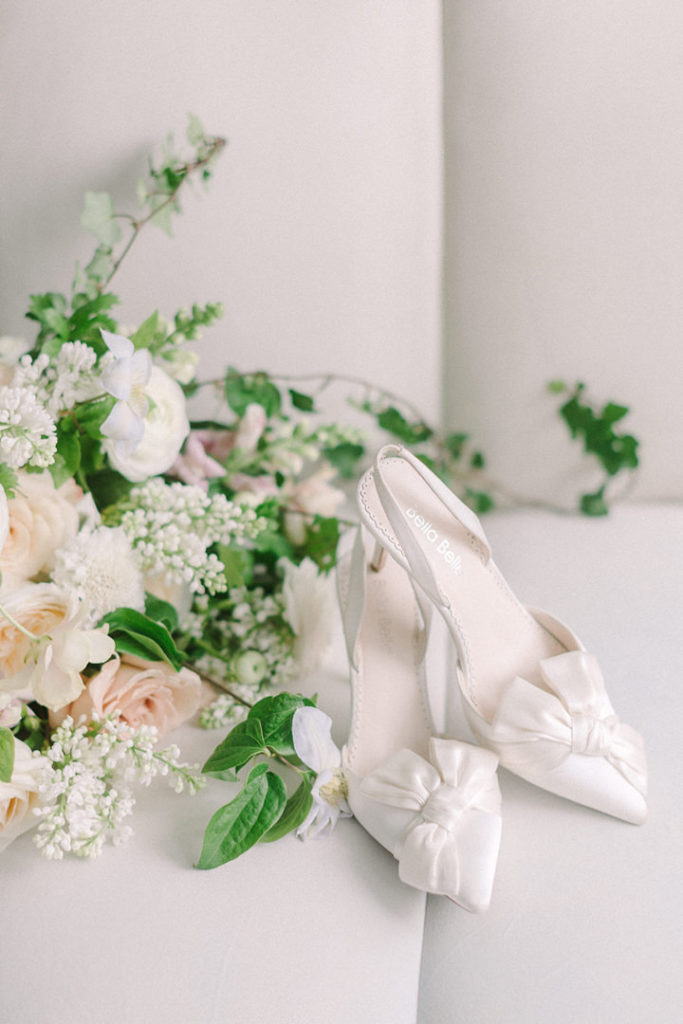 Bella Belle wedding shoes positioned beside the brides bouquet for a stunning detail shot