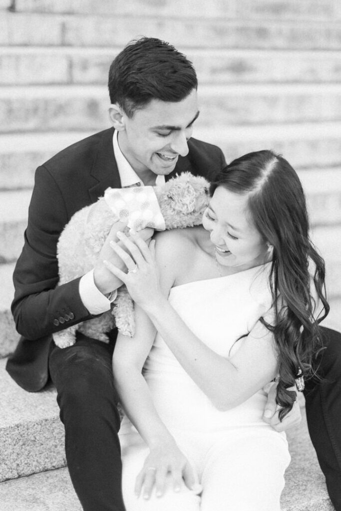 engagement photography captures a newly engaged couple and their pet during their photoshoot
