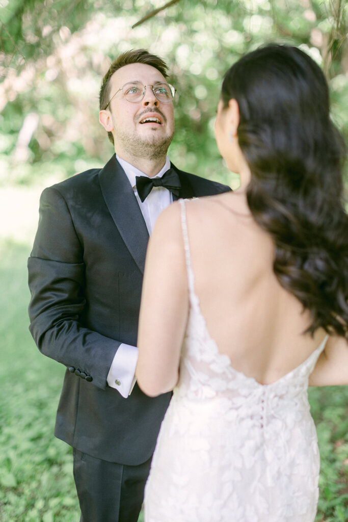 Groom catches his breath after seeing his bride for the first time on their wedding day in Montreal