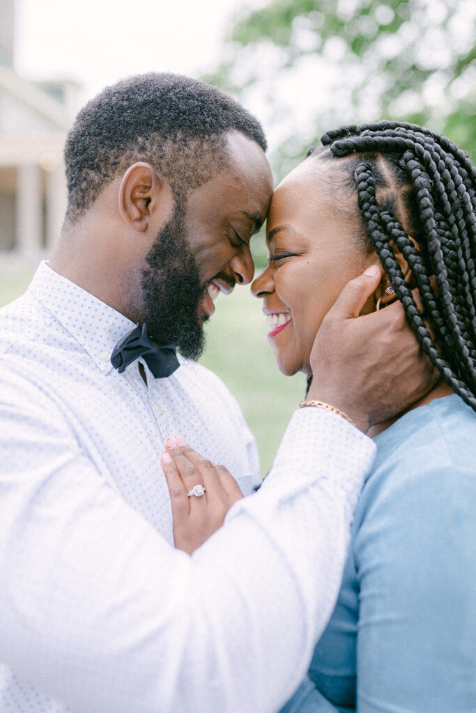 happy couple touches foreheads intimately during their Montreal engagement session